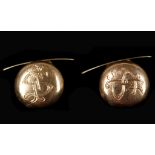 A pair of antique yellow gold button cuff links wi