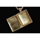 A 14k gold book-form locket, together with a heavy