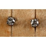 A pair of white gold and diamond stud earrings