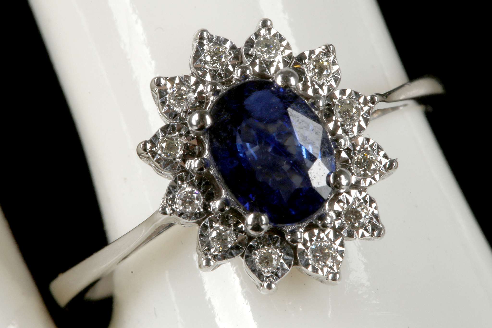 An 18ct white gold, sapphire and diamond cluster r