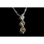 An 18ct white gold and diamond drop pendant, set w