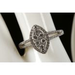 An 18ct white gold and pave set diamond ring