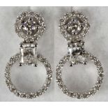 A fine pair of 18ct white gold and diamond set ear