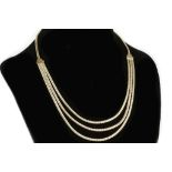 A 14k articulated necklace, with textured finish a