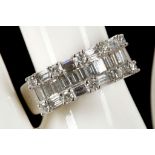 An 18ct white gold and diamond half eternity dress