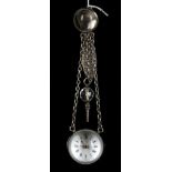 An antique continental silver cased ball watch, suspended from a silver chatelaine clip with key