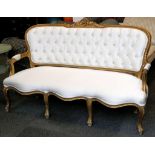 A French style triple seat sofa, gilt floral and l