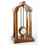 An 8 day Edwardian gravity clock in light mahogany