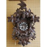 A Bavarian Black Forest cuckoo clock, eagle and gr