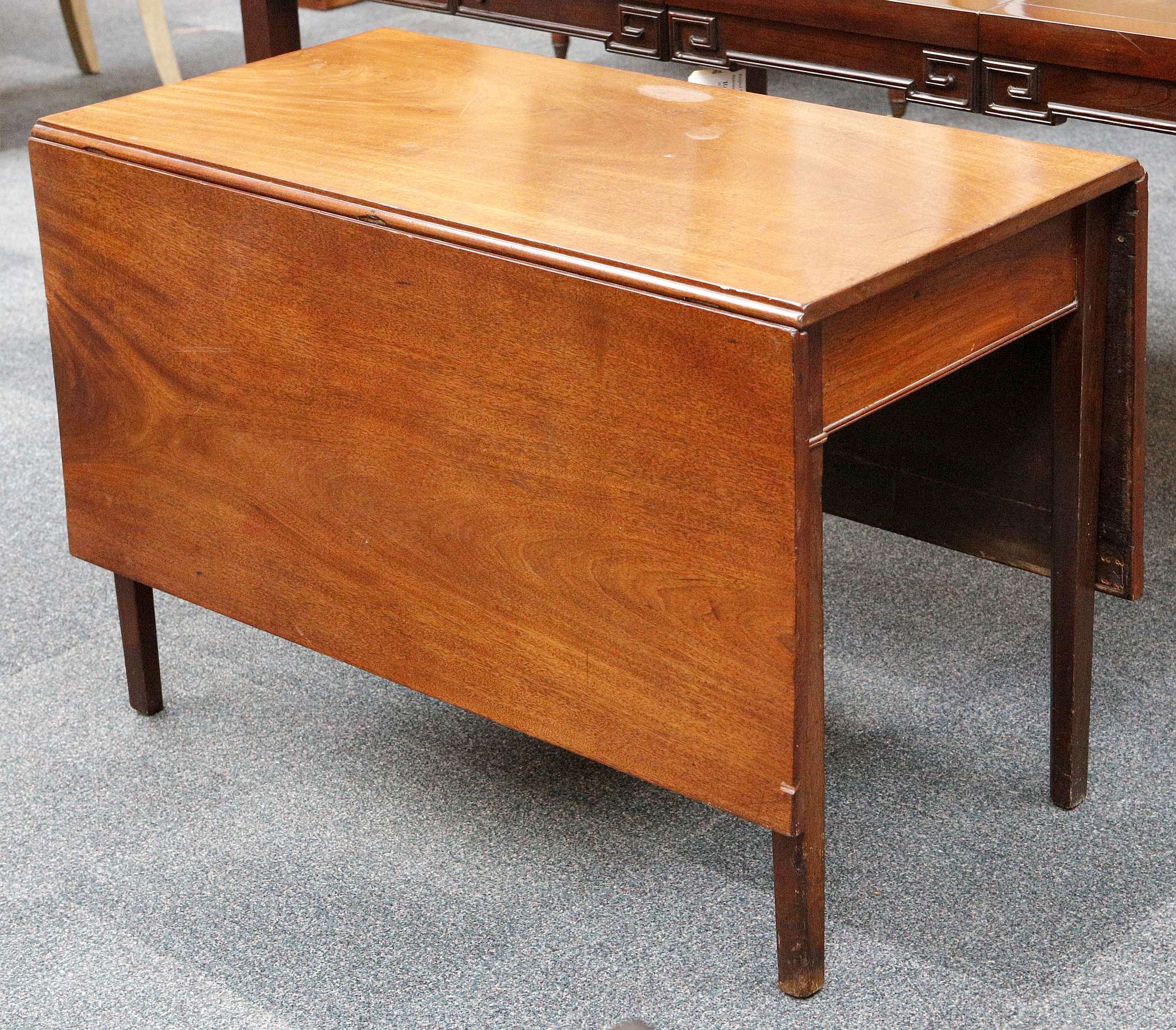 A Victorian mahogany drop leaf table supported on