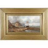 A gilt framed oil painting, coastal scene with beached fishing boat figures and cliffs beyond, 19.