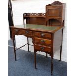 An Edwardian ladies desk, walnut with green leather insert with gilt tooling, petal carving to