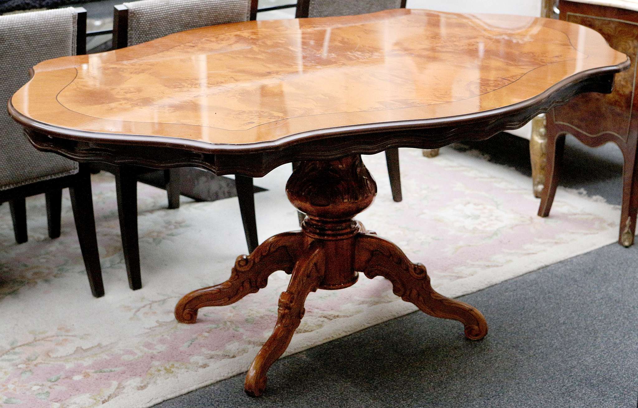 A contemporary burr walnut shaped centre table, ca