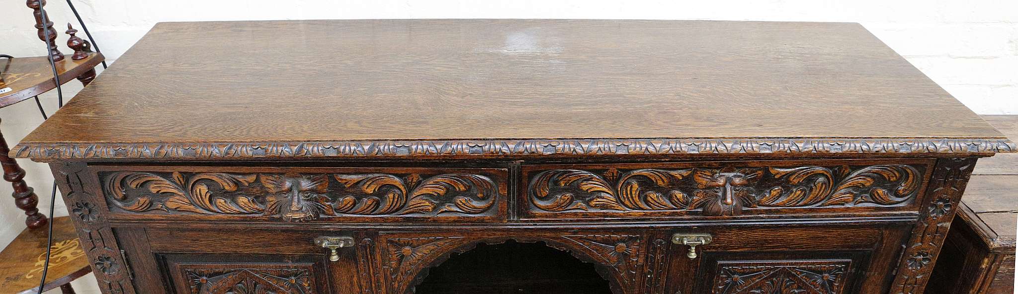 A late Victorian gothic oak sideboard, foliate carving to edge, man of forests masks to two drawers, - Image 3 of 3