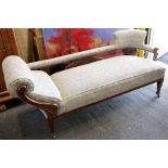 A late Victorian mahogany framed chaise lounge and two matching armchairs
