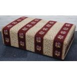 An upholstered large box stool, mottled yellow, claret and floral banding, 125 x 75cm