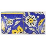 2 Iznik Persian decorated floral tiles, each appro