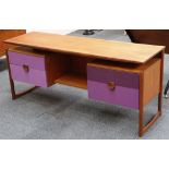 A 1970s teak dressing table, floating design top with double pedestal, the two drawers either side