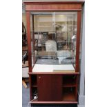 A mahogany and glazed shop display case