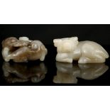 TWO CHINESE JADE CARVINGS.  Late Qing.  Comprising a recumbent ox, 7cm long, together with a cat