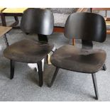 A pair of ebonised ash Charles Eames L.C.W. chairs
