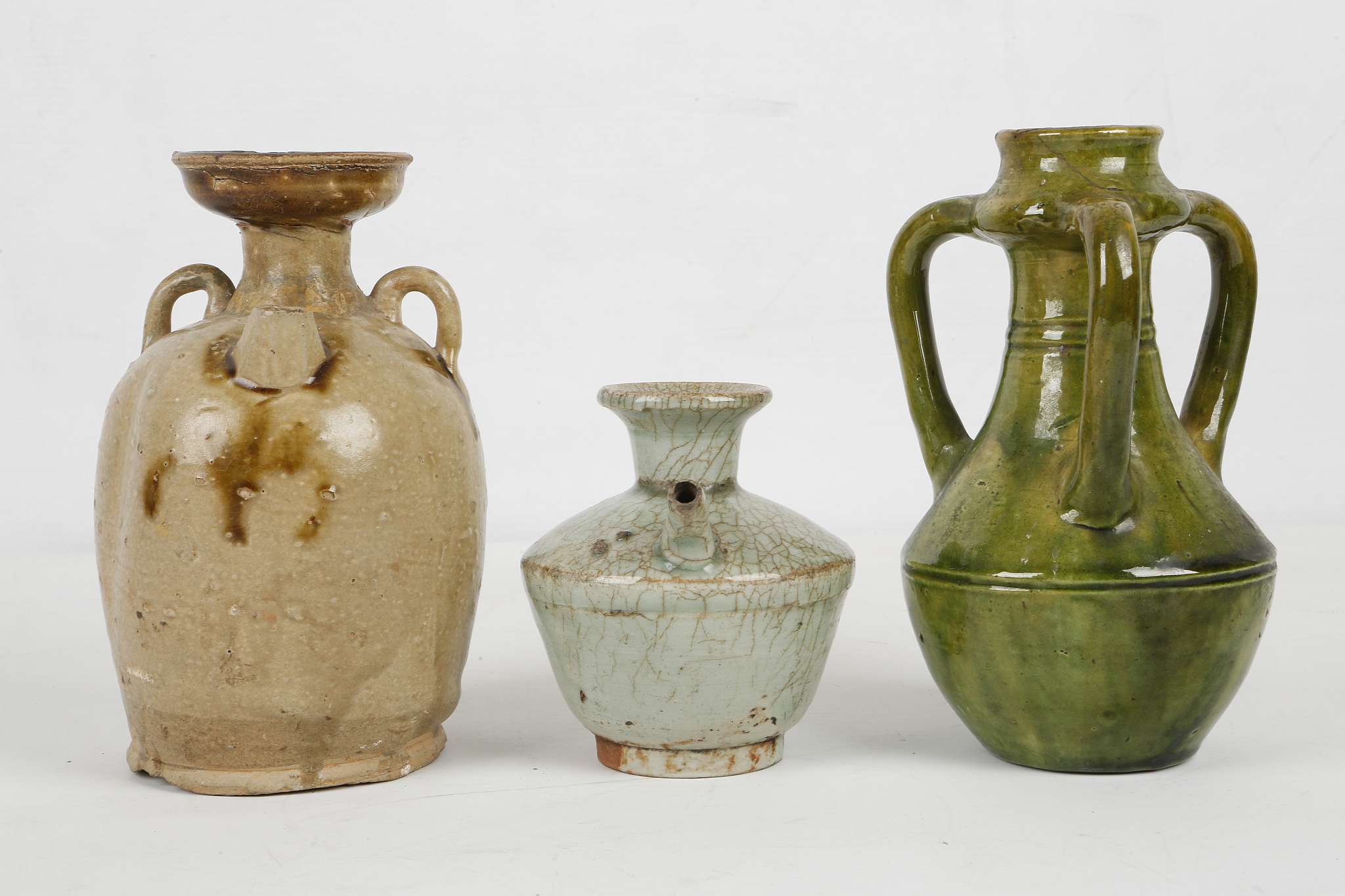 THREE CHINESE GLAZED STONEWARE CERAMICS. Tang Dynasty or later. Comprising an olive green glazed - Image 2 of 7