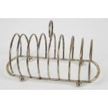 An early 20th century Chinese export silver 8 bar toast rack, raised on four ball feet