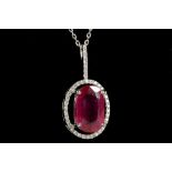 An 18ct white gold, ruby and diamond pendant on chain, ruby: 6.36cts, treated