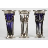 A pair of late Victorian Walker & Hall hallmarked silver pierced neo-classical spill vases, having