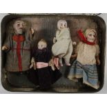 A 19th century miniature doll family, possibly German, bisque heads, children bisque articulated