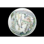 A CHINESE FAMILLE VERTE WOMEN WARRIORS CHARGER.  Kangxi. With shallow rounded sides rising to a