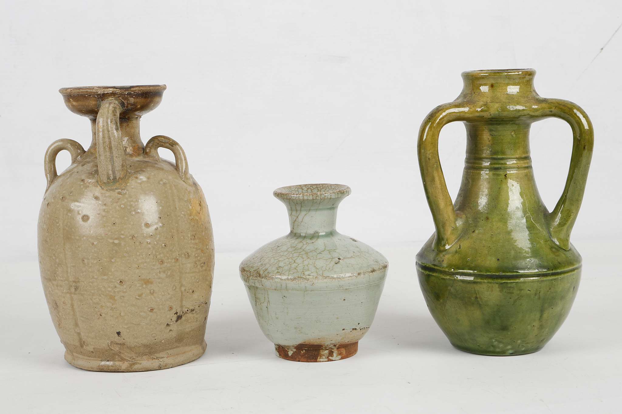 THREE CHINESE GLAZED STONEWARE CERAMICS. Tang Dynasty or later. Comprising an olive green glazed - Image 4 of 7