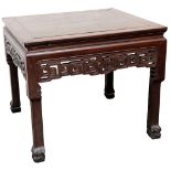A CHINESE HARDWOOD TABLE. Late Qing. Of square section, the aprons carved and pierced with T-