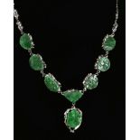 A 14ct white gold necklace set with carved jade panels