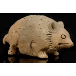 A PAINTED POTTERY RAT. Yuan Dynasty. Modelled crouching, with carved details and traces of