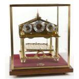 A gilt brass Congreve rolling ball clock by Dent c