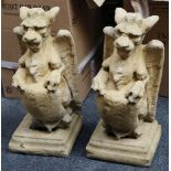 A pair of griffins, made from Devon stone, with st