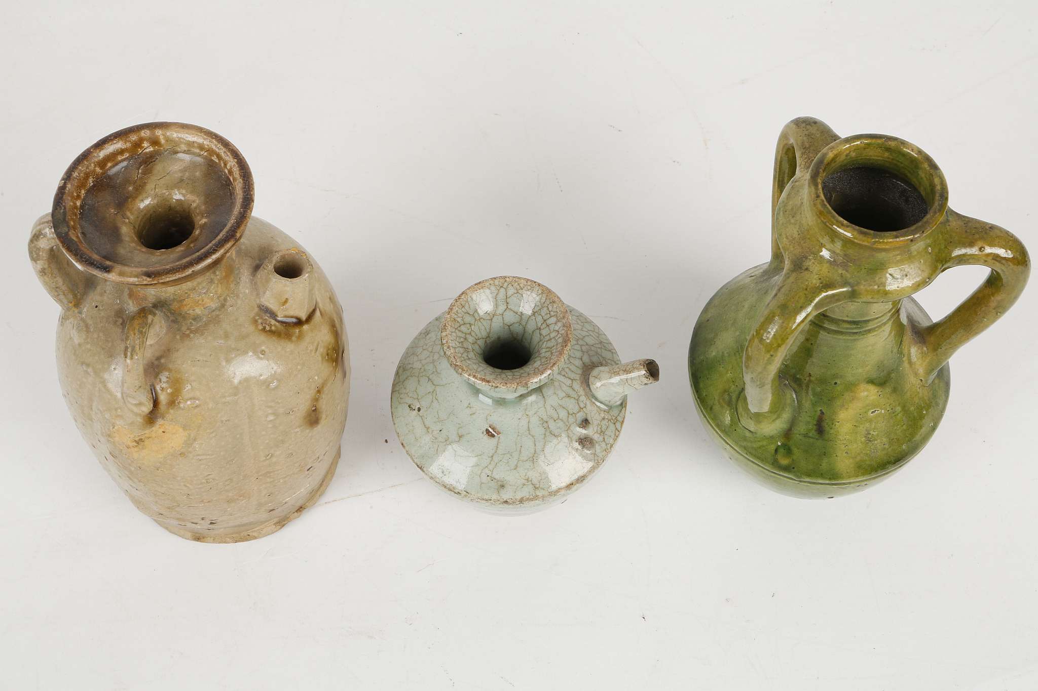 THREE CHINESE GLAZED STONEWARE CERAMICS. Tang Dynasty or later. Comprising an olive green glazed - Image 6 of 7