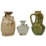 THREE CHINESE GLAZED STONEWARE CERAMICS. Tang Dynasty or later. Comprising an olive green glazed