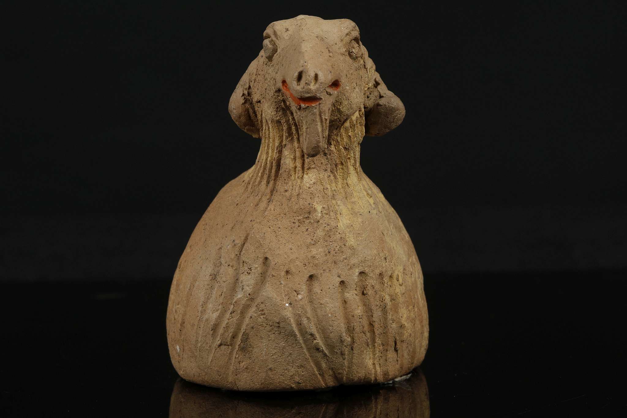 A PAINTED POTTERY GOAT. Yuan Dynasty. Modelled seated with the head slightly raised, with details - Image 5 of 7