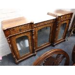 A 19th century breakfront chiffonier, the whole in figured walnut with frieze drawers above three