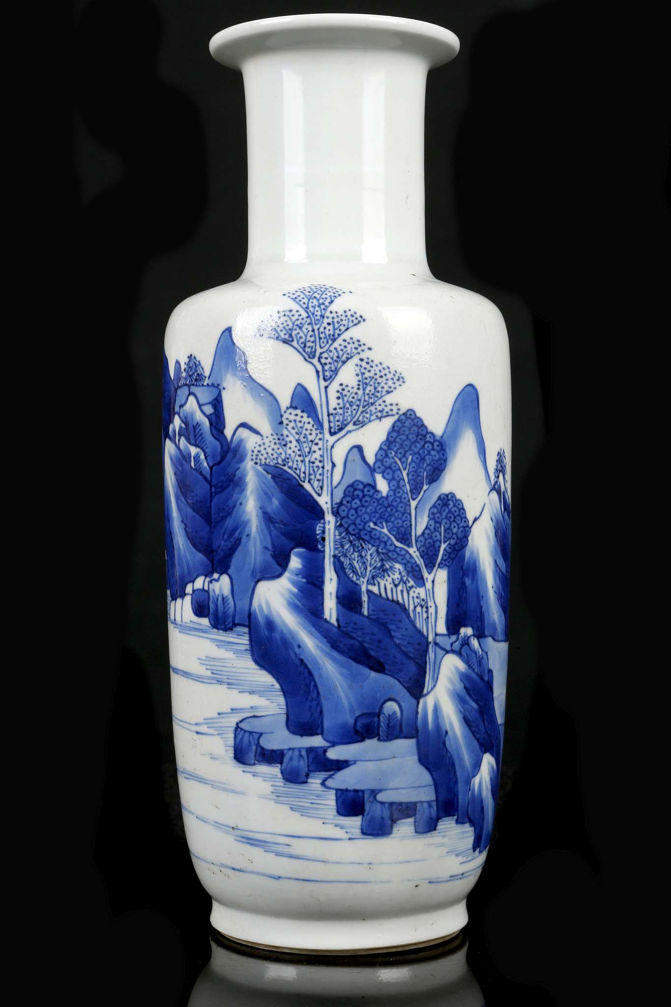 A CHINESE BLUE AND WHITE ROULEAU VASE.  Kangxi.  Finely painted around the body with a continuous