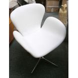 An aviation style aluminium chair with white leath