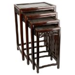 A NEST OF FOUR CHINESE ROSEWOOD OCCASSIONAL TABLES. Early 20th Century. Each with a rectangular