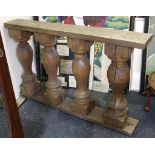 A pine part balustrade with four turned baluster s