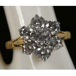 A diamond 7 stone cluster ring in 18ct gold
