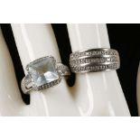A 9ct white gold and diamond set ring together with a 9ct white gold blue stone and diamond set ring