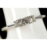 An 18ct white gold and diamond 3 stone ring