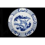 A CHINESE BLUE AND WHITE PLATE.  Kangxi mark and of the period.  The central roundel painted with