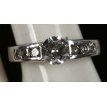 A diamond single tone ring with diamond shoulders